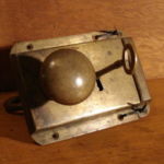 Brass railroad lock with ring pull and key (side 1) 201-5687-1-1-1